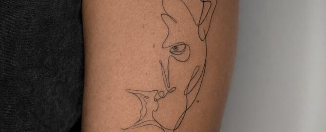 Abstract fine-line tattoo of a panther’s head