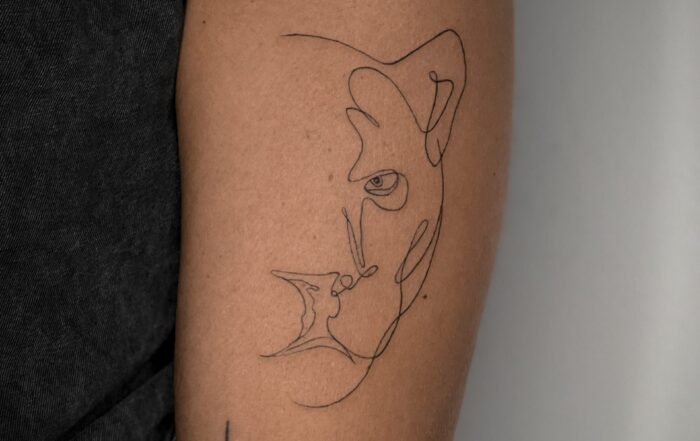Abstract fine-line tattoo of a panther’s head