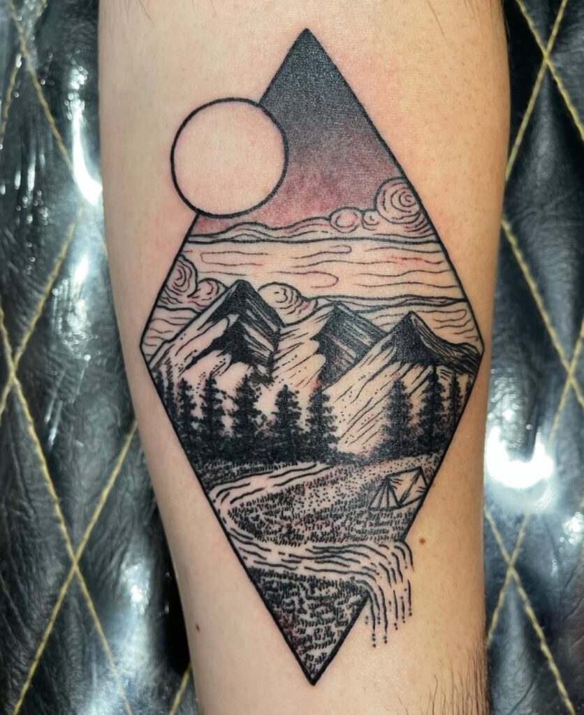 Geometric black line tattoo of mountains, trees, and a moon arranged within a diamond shape on the lower leg.