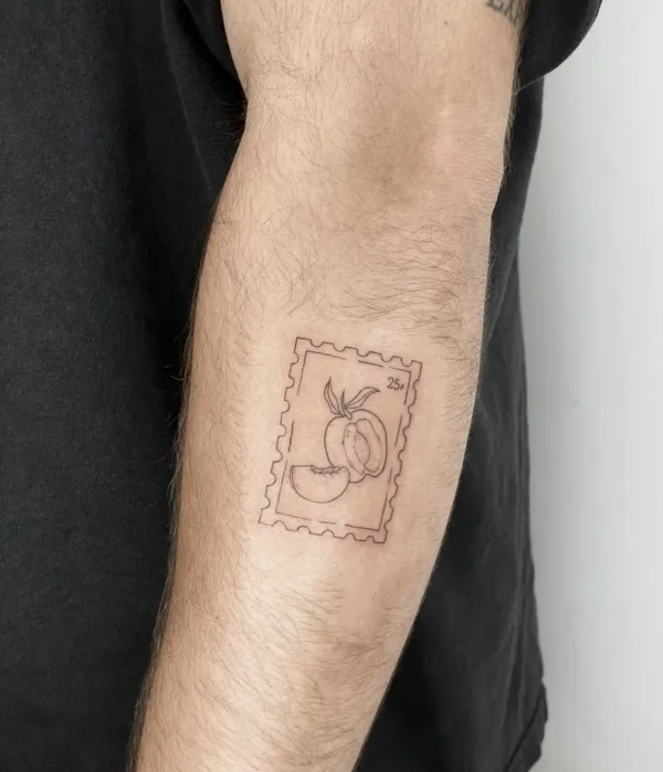 A minimalist, fine-line tattoo on a forearm depicting a small postage stamp. Inside the jagged border of the stamp is a simple line drawing of a sliced peach and a "25¢" denomination.